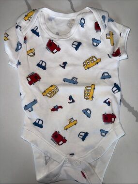 White Baby Onesie with Red, Yellow & Blue Vehicle Print